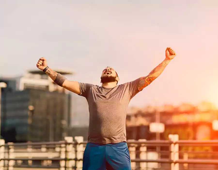 man_raising_hands_up_celebrating